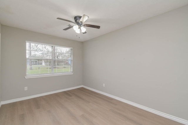 spare room featuring ceiling fan and light hardwood / wood-style flooring