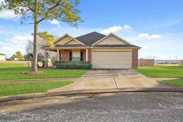 view of front of property featuring a garage and a front yard