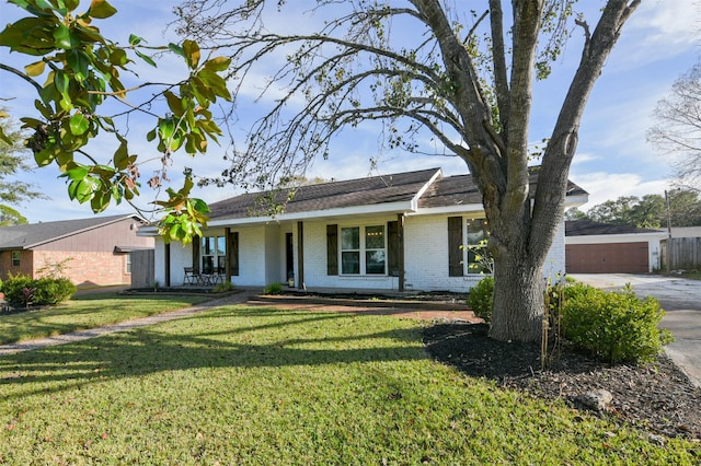 single story home with a garage and a front yard