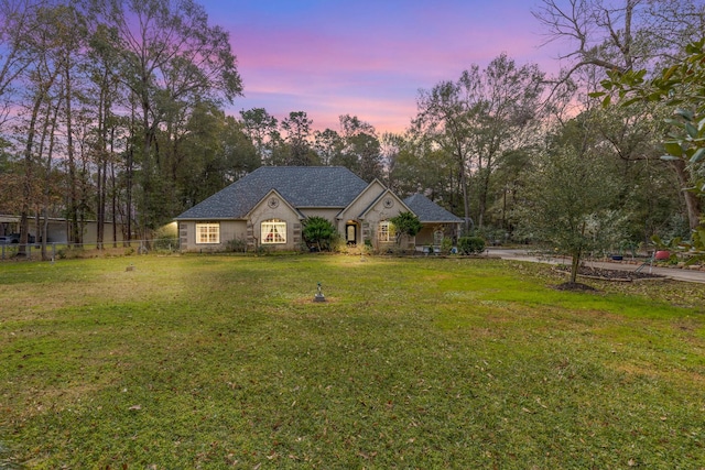 view of front of house with a yard