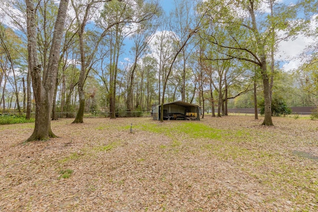 view of yard with a carport