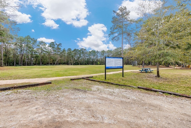 view of home's community featuring a lawn