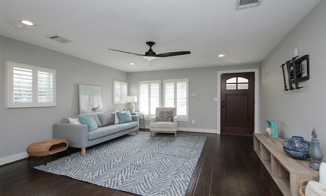 living room featuring ceiling fan and wood-type flooring