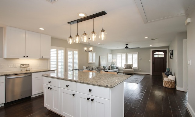 kitchen with ceiling fan, backsplash, white cabinetry, and dishwasher