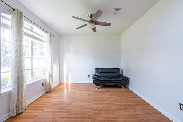 unfurnished room with ceiling fan and light hardwood / wood-style floors