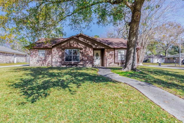 ranch-style home featuring a front yard