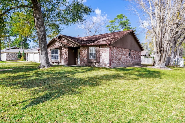 single story home with a garage and a front yard