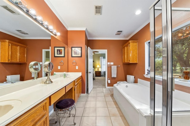 bathroom with ornamental molding, a bathtub, tile patterned floors, and vanity