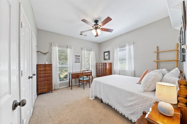 10403 W Hidden Lake Ln, Richmond, TX 77406 - bedroom with light colored carpet and a ceiling fan
