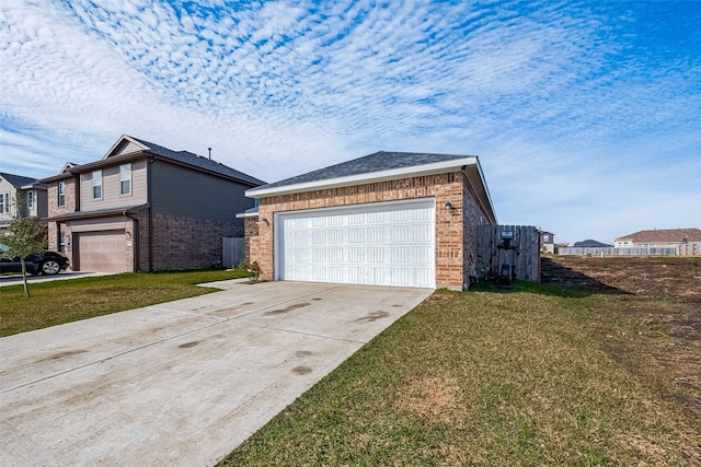 view of home's exterior with a garage and a lawn