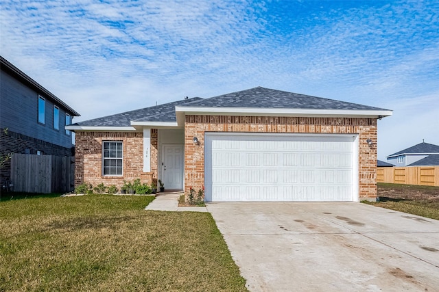 ranch-style home featuring a front yard and a garage