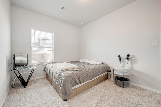 bedroom with light colored carpet