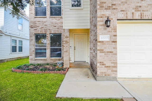 doorway to property featuring a garage