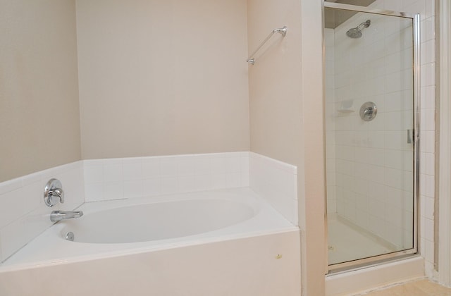 bathroom with shower with separate bathtub