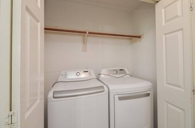 washroom with washer and dryer