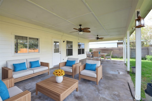 view of patio with an outdoor living space and ceiling fan