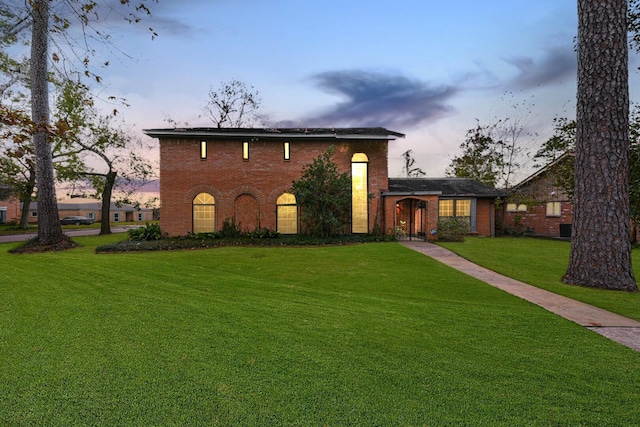 view of front of house with a lawn