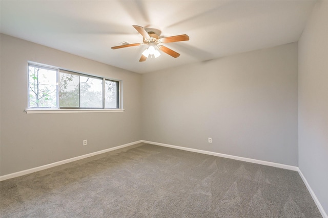 empty room featuring ceiling fan and carpet flooring