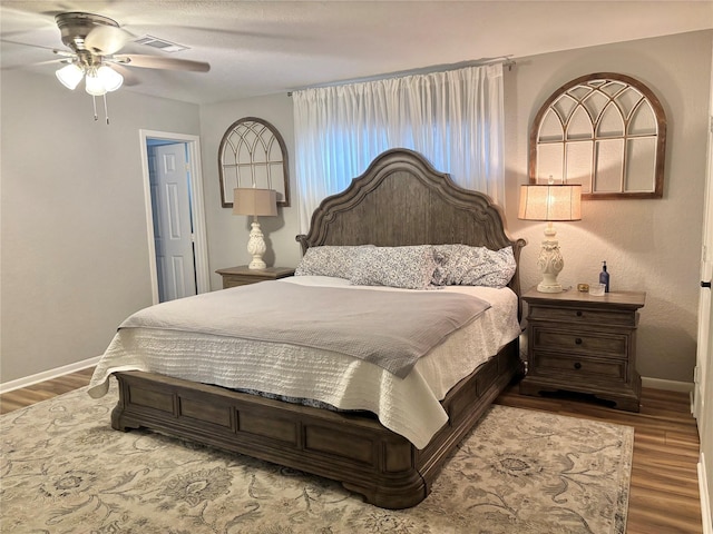 bedroom with hardwood / wood-style flooring and ceiling fan