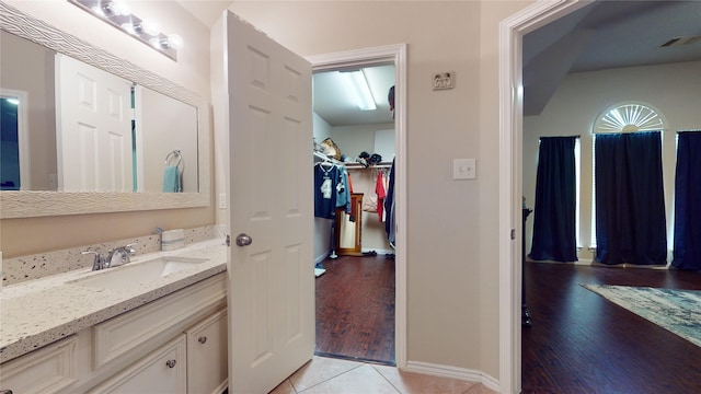 bathroom with tile patterned flooring and vanity