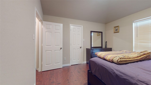 bedroom featuring dark hardwood / wood-style flooring