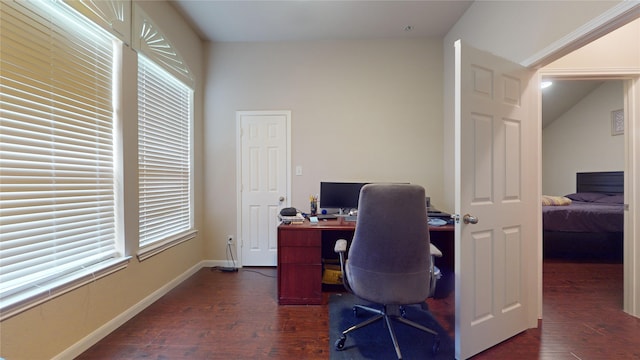 home office featuring plenty of natural light and dark hardwood / wood-style flooring