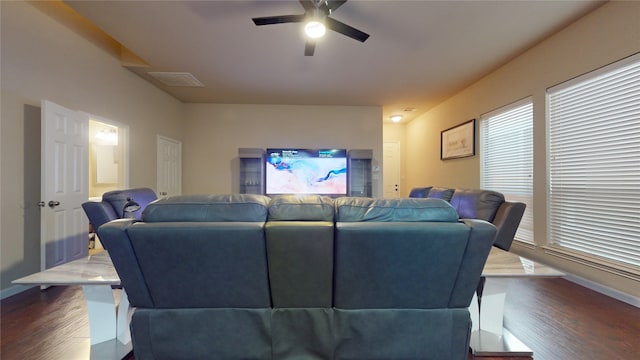 living room with ceiling fan and dark hardwood / wood-style flooring