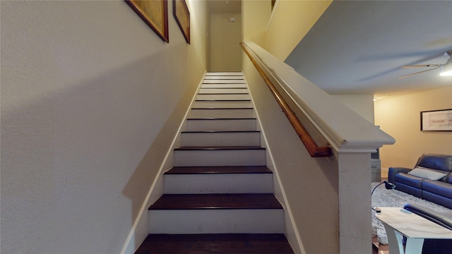 staircase with ceiling fan