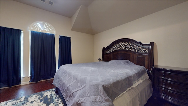 bedroom featuring dark hardwood / wood-style flooring