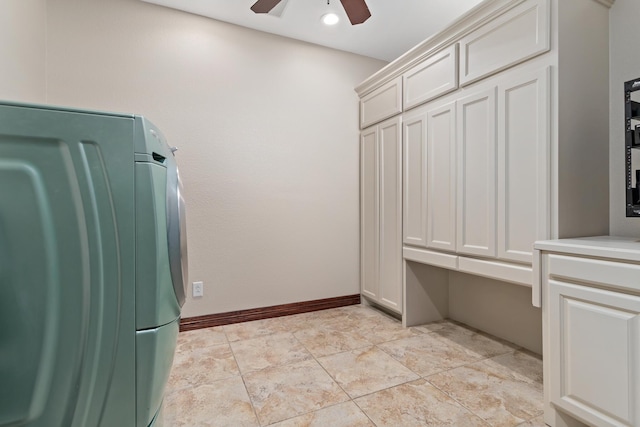 laundry room featuring ceiling fan, cabinets, and washer / clothes dryer