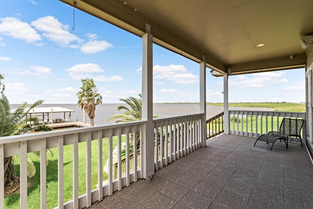 balcony featuring a water view