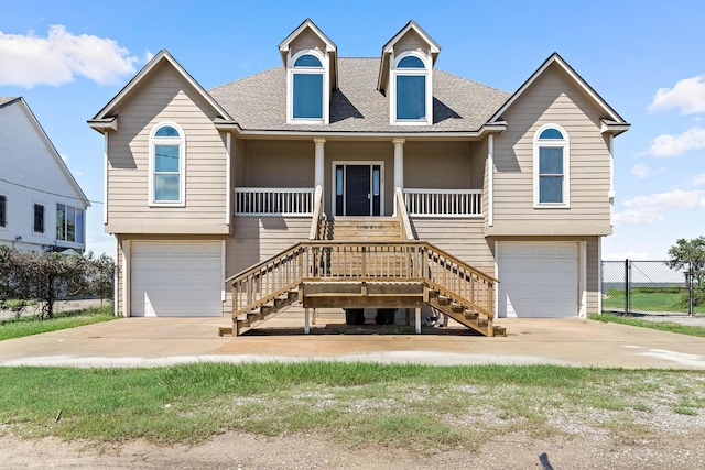 view of front of home featuring a garage and a porch