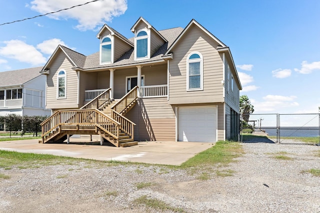 view of front of house featuring a porch and a garage