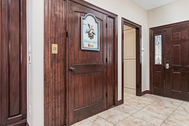 entryway featuring light tile patterned floors