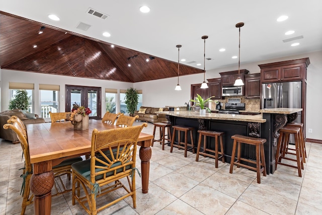 dining area featuring a healthy amount of sunlight, french doors, wood ceiling, and light tile patterned floors