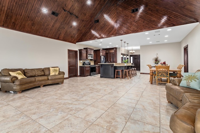 tiled living room with wooden ceiling and a high ceiling