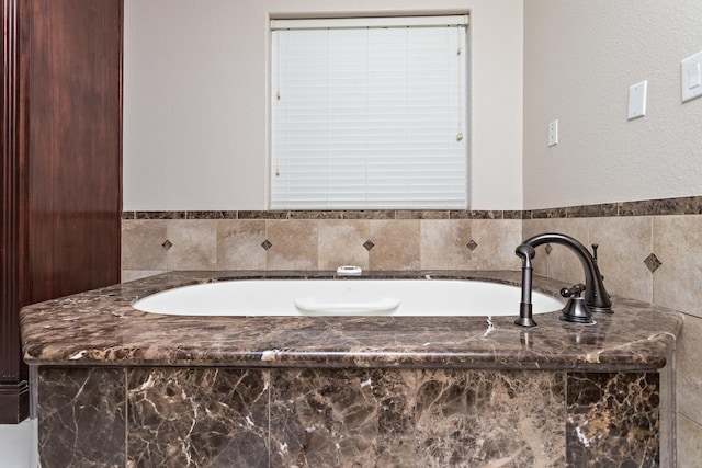 bathroom with a tub