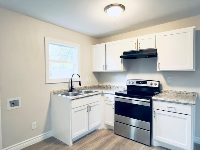 kitchen with sink, white cabinets, light hardwood / wood-style flooring, and stainless steel range with electric cooktop