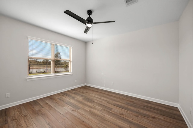 empty room featuring ceiling fan and hardwood / wood-style flooring