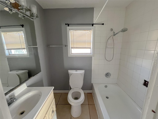 full bathroom featuring toilet, vanity, tile patterned floors, and tiled shower / bath