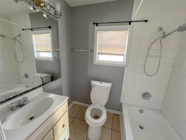 full bathroom featuring toilet, vanity, tile patterned flooring, and tiled shower / bath combo