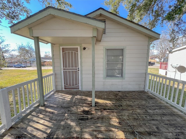 wooden deck featuring a yard