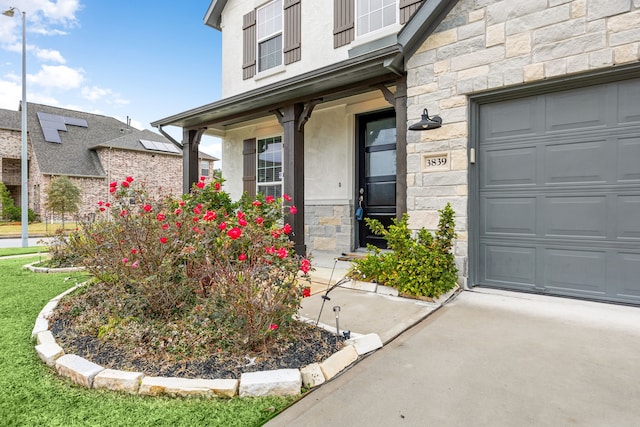 view of exterior entry featuring a garage