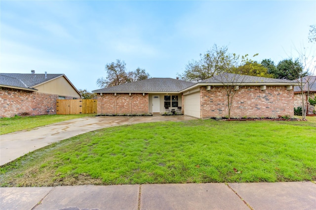 view of front of house featuring a garage and a front yard