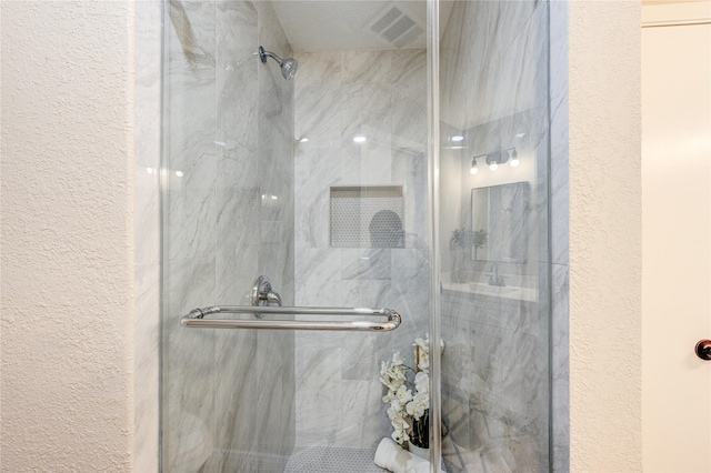 bathroom with an enclosed shower