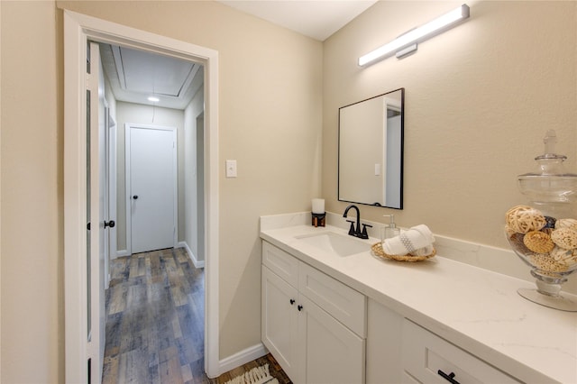 bathroom featuring hardwood / wood-style flooring and vanity