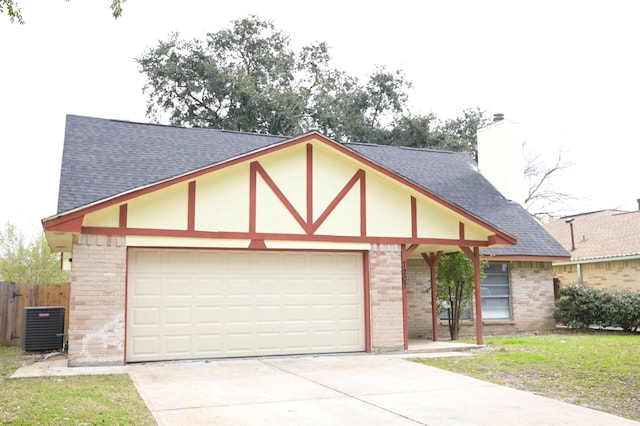 tudor home with a front lawn and central AC