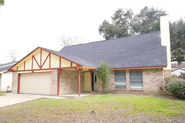 view of front of property with a garage and a front yard