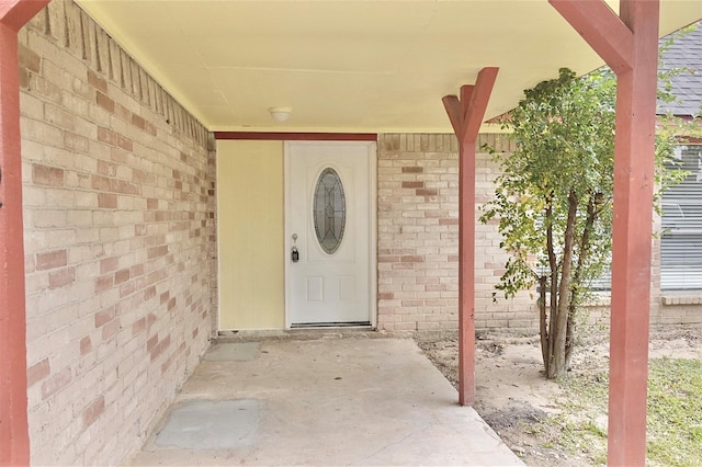 entrance to property featuring a patio