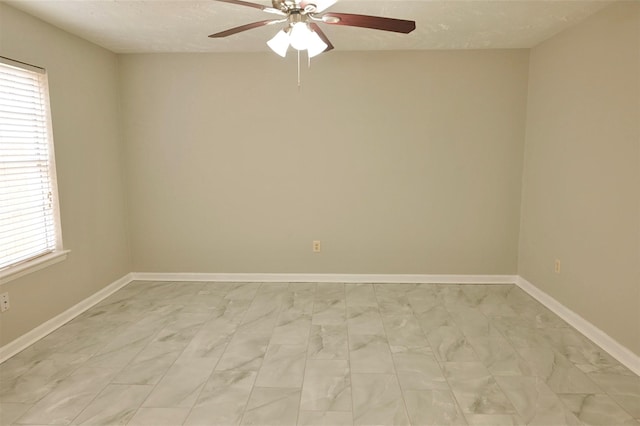 spare room with ceiling fan